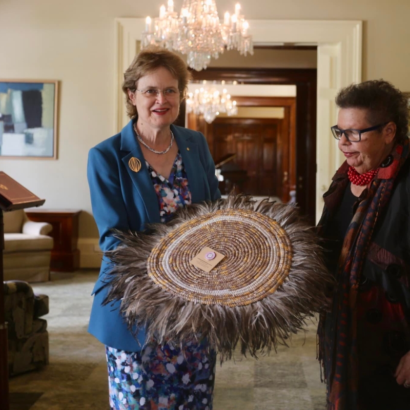 Her Excellency receiving a woven mat from members of the Firestick Alliance