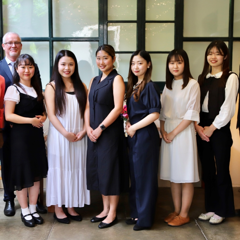 Her Excellency and Mr Bunten with students of Shujitsu University